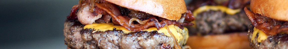 Eating Burger Fast Food at Boardwalk Fresh Burgers & Fries restaurant in Alexandria, VA.